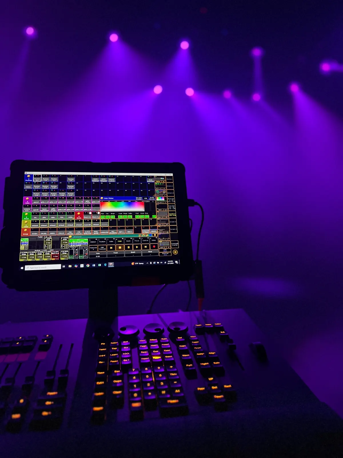 Lighting console and purple stage lighting at Qool Studio Miami